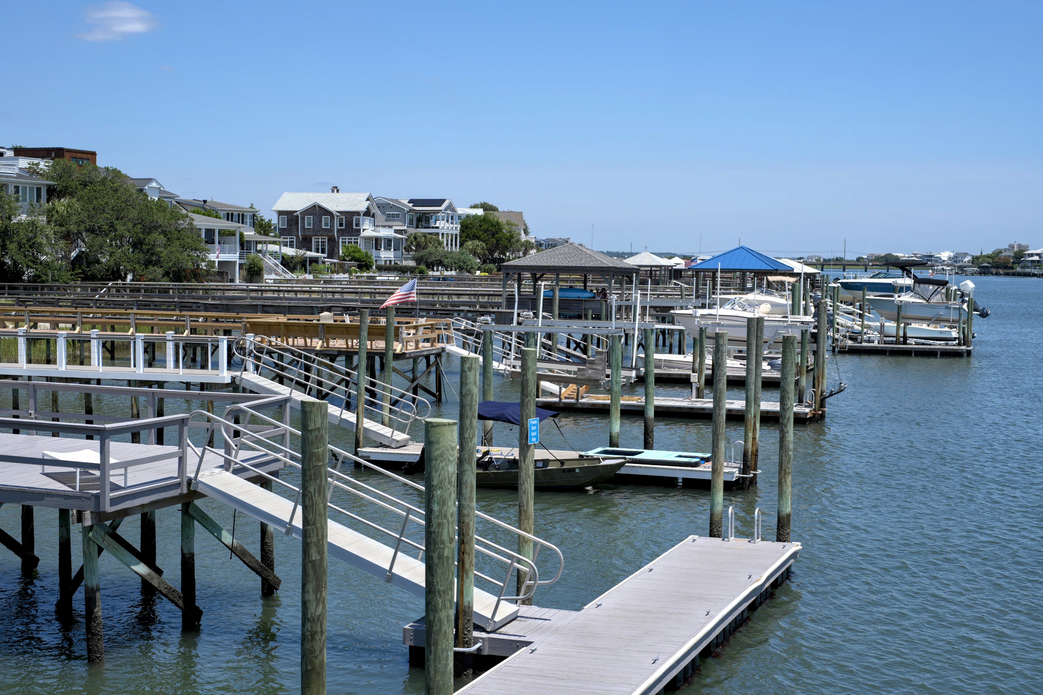 Private boat docks and waterfront homes along Banks Channel in Wrightsville Beach, NC.