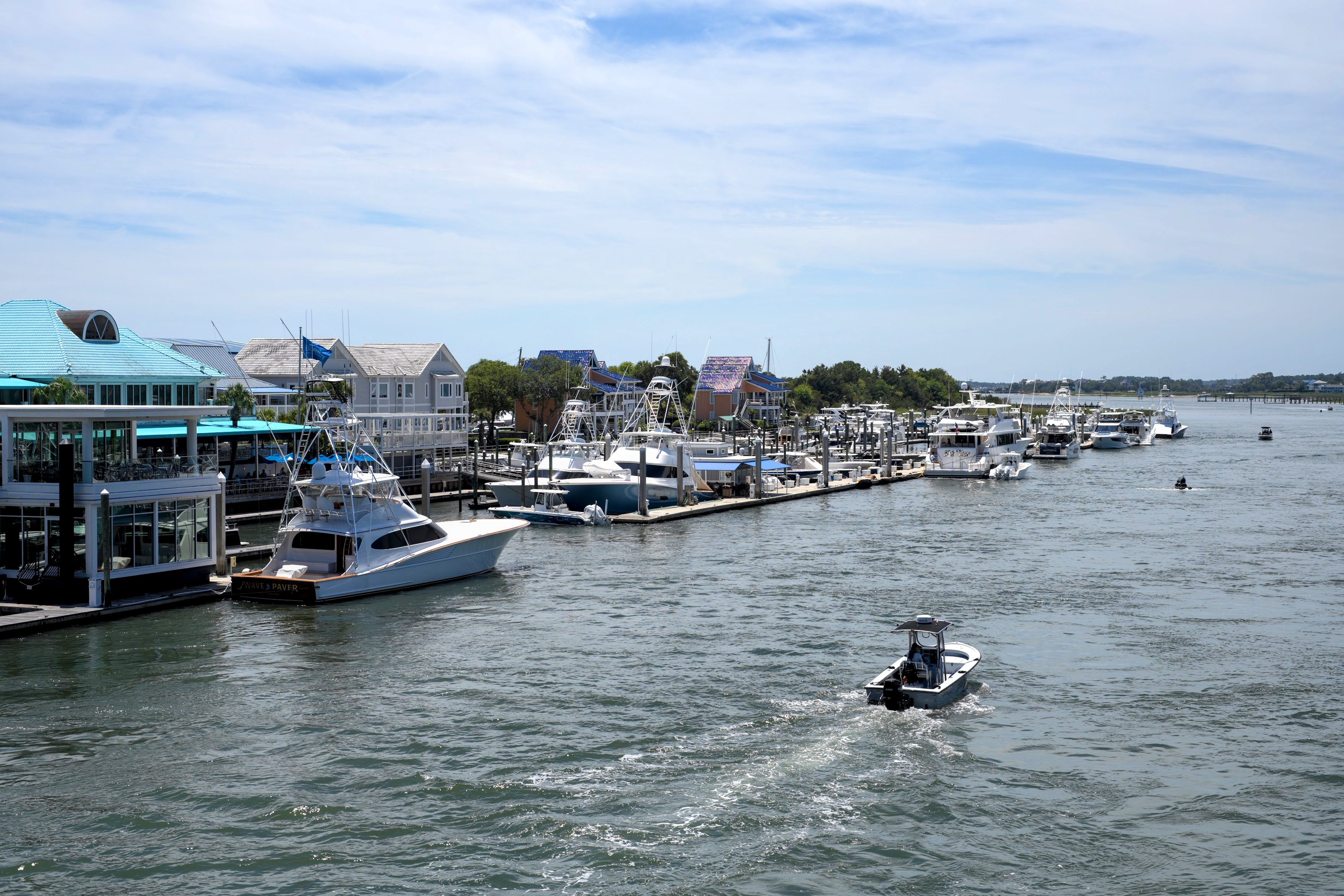 Waterfront restaurants, marinas, and boats along the Intracoastal Waterway in Wrightsville Beach, NC.