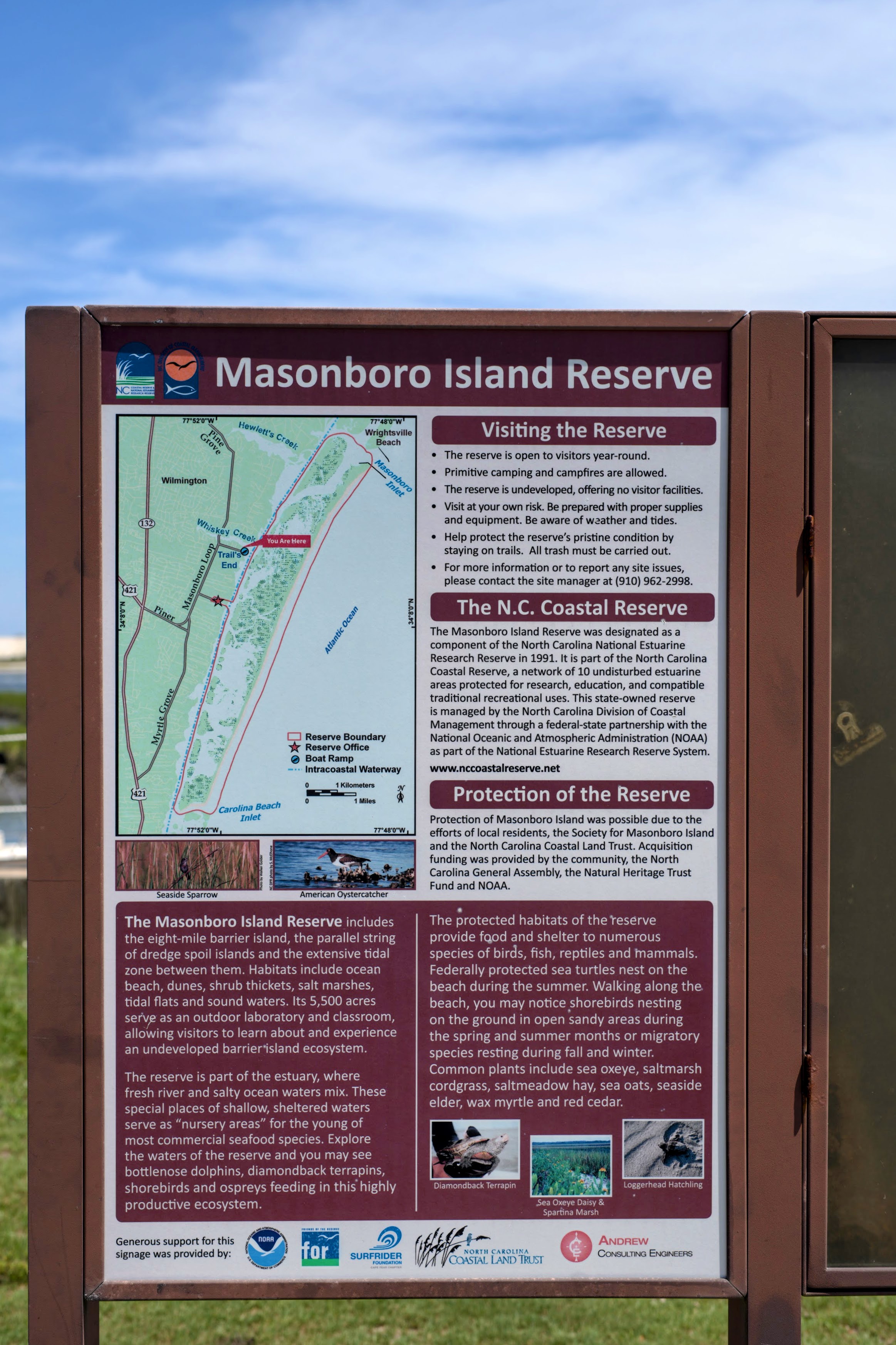 Masonboro Island Reserve information sign with a map and visitor guidelines near Wilmington, NC.