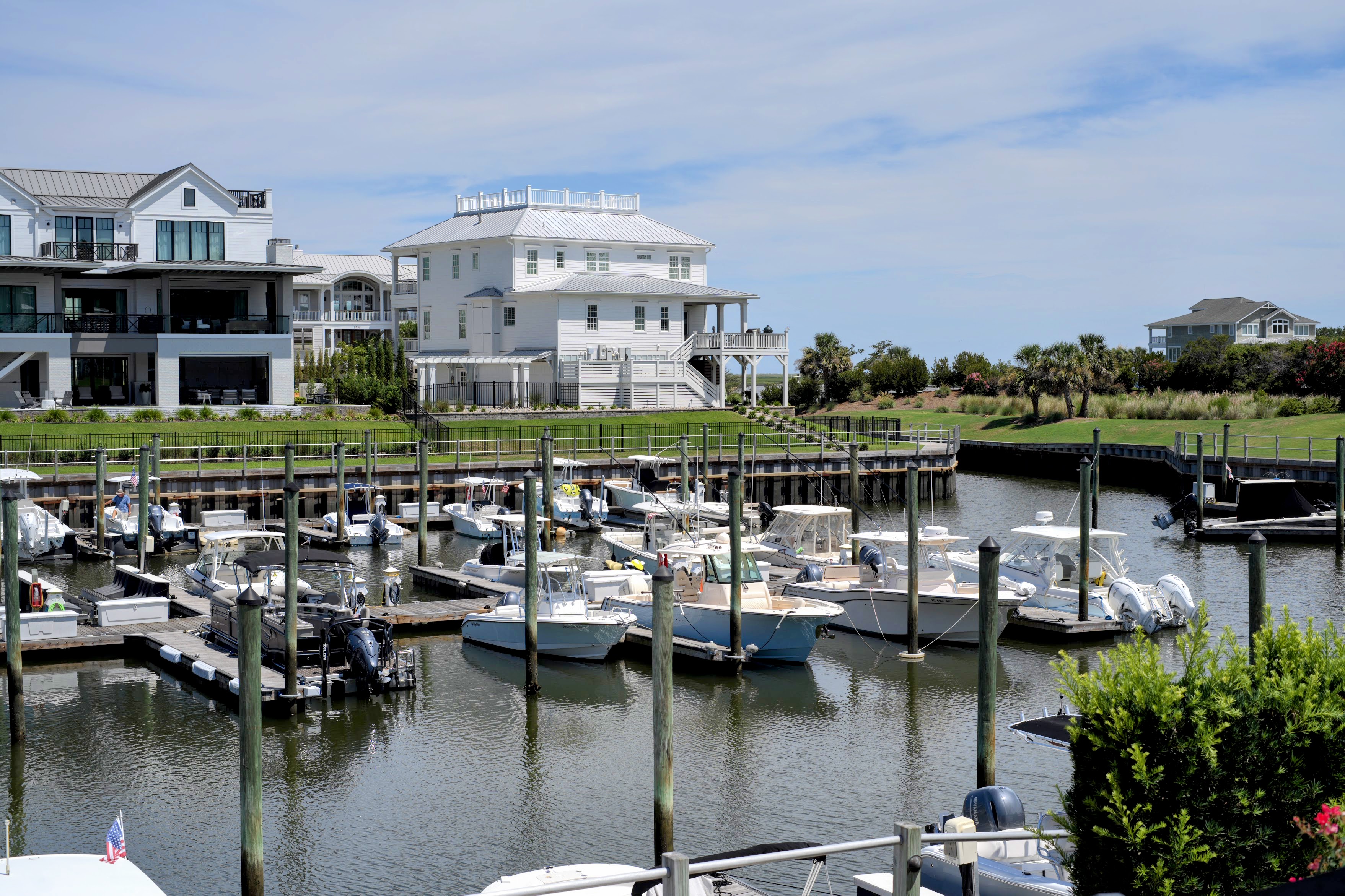 Marina full of boats in front of waterfront homes at Wrightsville Beach, NC.