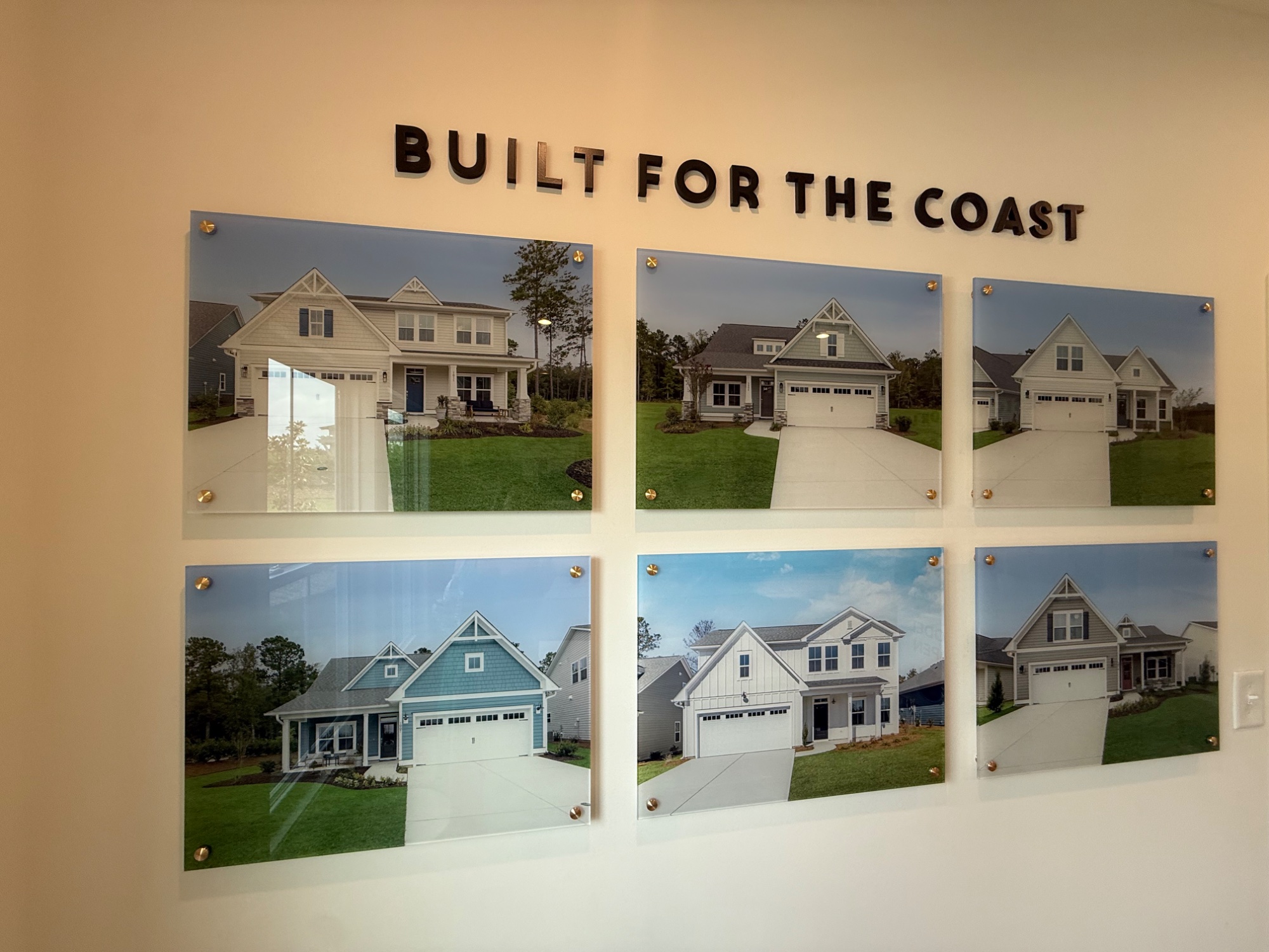 A 'Built for the Coast' builder display of completed craftsman-style homes.