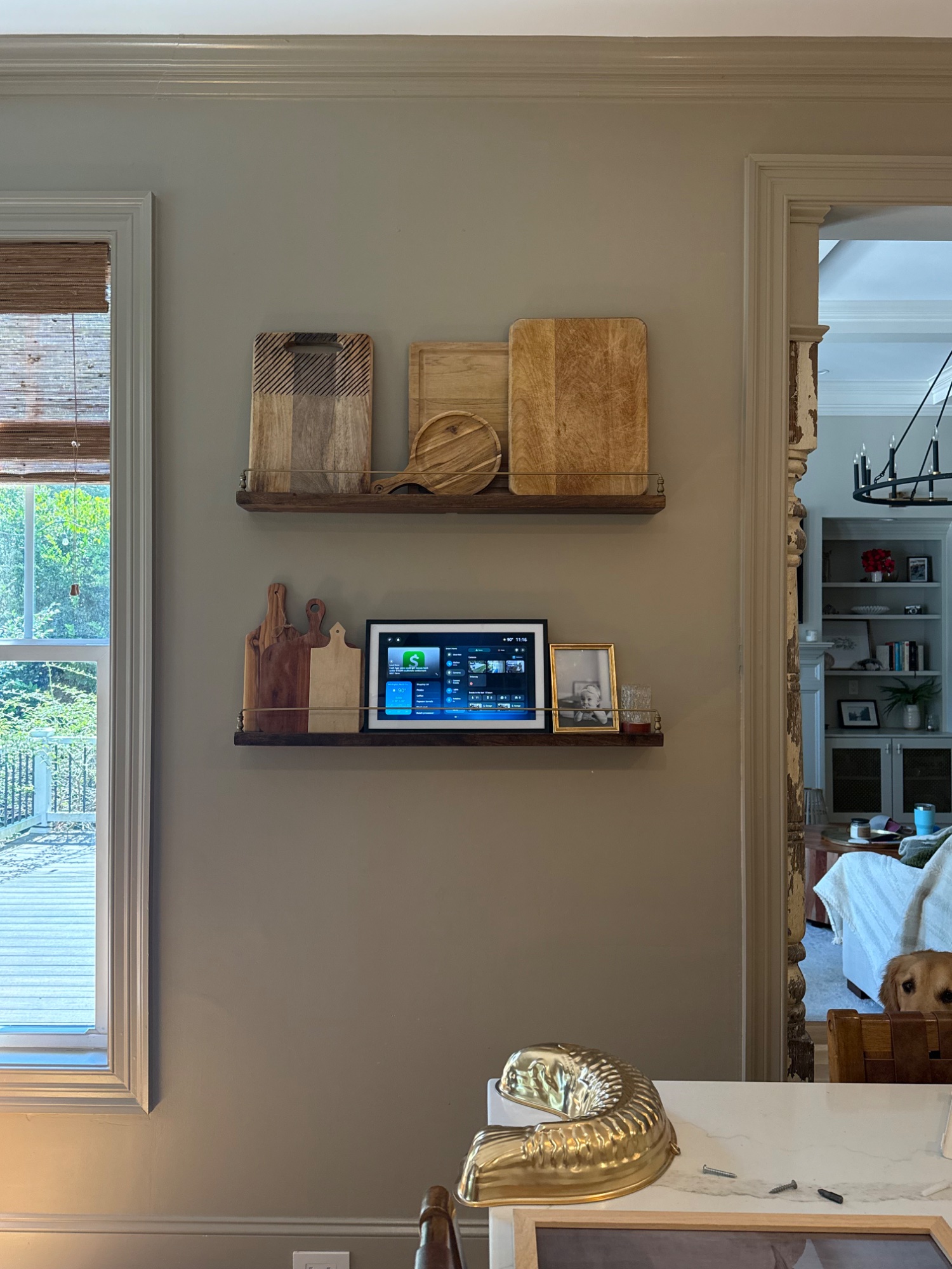 Styled kitchen shelves with smart-home tablet