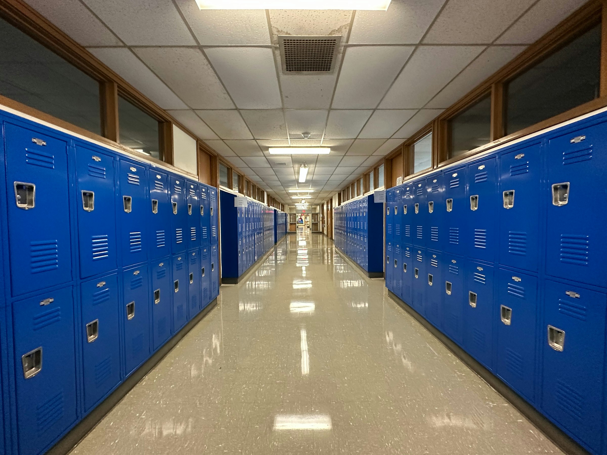 Long school hallway lined with lockers.